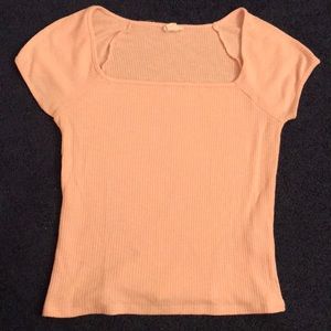 Tight fit light pink ripped crop tee